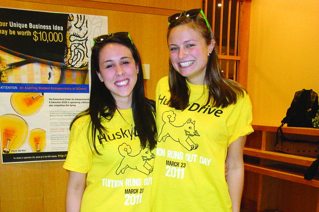 From left: Mallory Walsh ’14 (CLAS) and Victoria South ’14 (BUS), members of the Student Philanthropy Committee, on Tuition Runs Out Day, held on March 23.