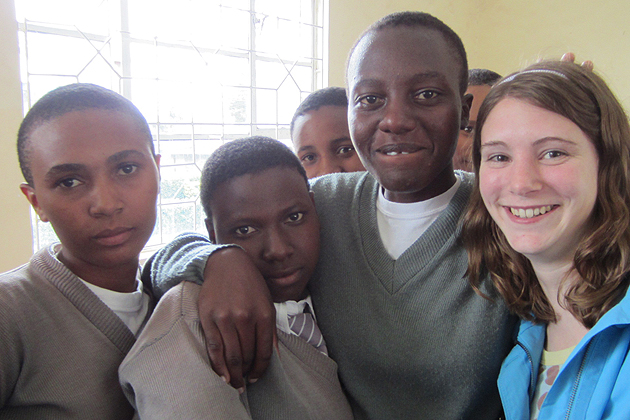 Briana Hennessy gathers with students while in Tanzania.