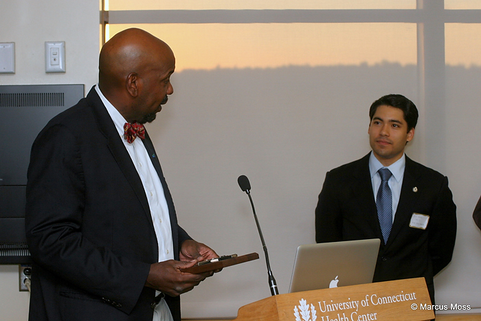 Dr. Cato T. Laurencin, left, former dean of the UConn School of Medicine, was honored for his support and advocacy for students at the "2011 Leaders in Medicine Meet and Greet." At right is UConn student Luis Daniel Munoz Jr., one of the event's organizers. (Marcus Moss)