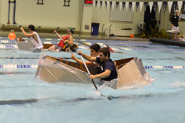 Team Michael and McElroy races against Those D Bags in the pool in their cardboard canoe in the Wolff-Zackin Natatorium on Oct. 27, 2011. (Ariel Dowski for UConn)