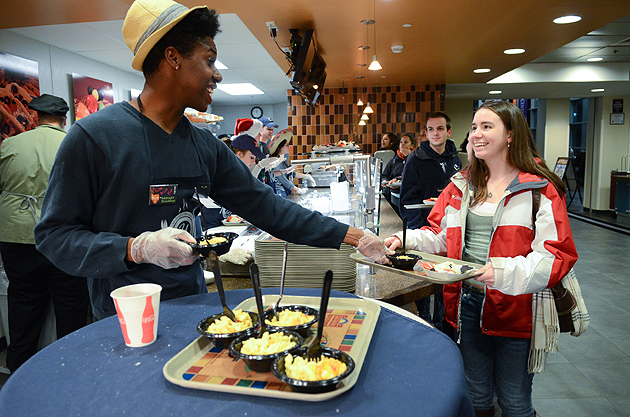 A staff member serves food to students in the Student Union at the Midnight Breakfast on Dec. 11, 2011. (UConn Photo / Max Sinton)