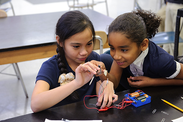 Fourth-graders perform an experiment with electromagnets at Dr. Joseph S. Renzulli Gifted and Talented Academy in Hartford on Dec. 14, 2011. (Peter Morenus/UConn Photo)