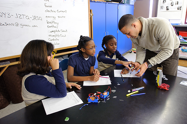 Fourth-graders perform an electromagnetic experiment with the help of their teacher Freddie DeJesus at Dr. Joseph S. Renzulli Gifted and Talented Academy in Hartford on Dec. 14, 2011. (Peter Morenus/UConn Photo)