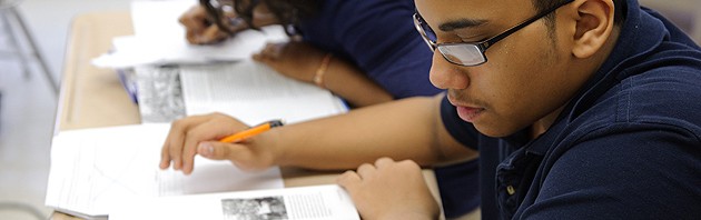 Sixth-graders work on writing projects with teacher Kim Albro at Dr. Joseph S. Renzulli Gifted and Talented Academy in Hartford on Dec. 14, 2011. (Peter Morenus/UConn File Photo)