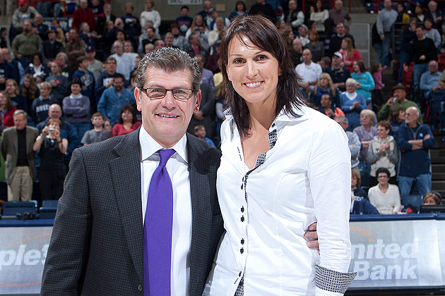 Geno Auriemma and Svetlana Abrosimova '01 (ED) during ceremonies for the 2002 NCAA Champions induction into the Huskies of Honor. Abrosimova was also honored for her individual Huskies of Honor recognition, which she was unable to attend in 2006 (Steve Slade '89 (SFA) for UConn)