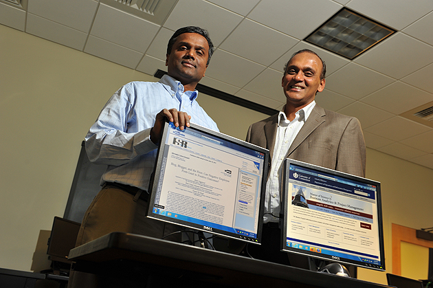 Ramesh Sankaranarayanan, left, and Ram Gopal at an MIS lab at the School of Business on Jan. 13, 2012. (Peter Morenus/UConn Photo)