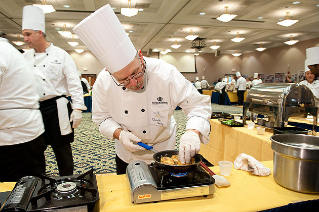 Charlie String of the South Marketplace checks his skillet during the 12th Annual Culinary Competition held at the Rome Commons Ballroom on Jan. 12, 2012. (Peter Morenus/UConn Photo)