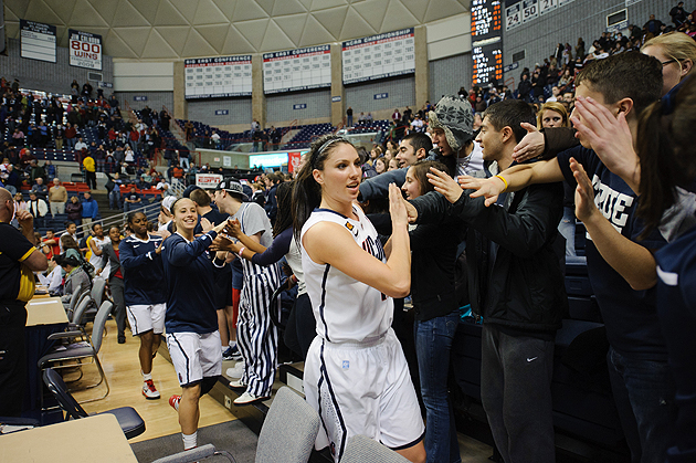 Lauren Engeln and other players give high fives to the fans following the women's basketball game against North Carolina at Gampel Pavilion on Jan. 16, 2012. (Peter Morenus/UConn Photo)