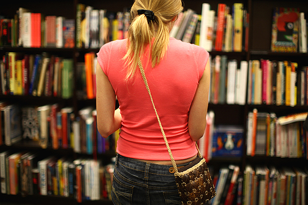 Woman browsing books in a book store.