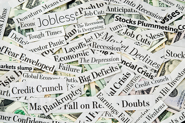 Newspaper headlines filled with news about: economy despair, crisis, money worries and dark tones about recession, depression and job losses.