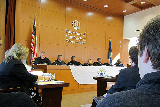The Connecticut Supreme Court meets at the School of Law's William R. Davis Courtroom , Tuesday morning, as part of its "On Circuit" program. The court heard the case of John A. O'Dell, Administrator v. Kozee et al. SC18551, which asks whether the Connecticut law that holds bars accountable for injuries or death inflicted by patrons they have over-served requires "visible" signs of intoxication. Arguing for the plaintiffs was a 1983 graduate of the law school, Ron Murphy.(Bianca Slota/UConn Photo)