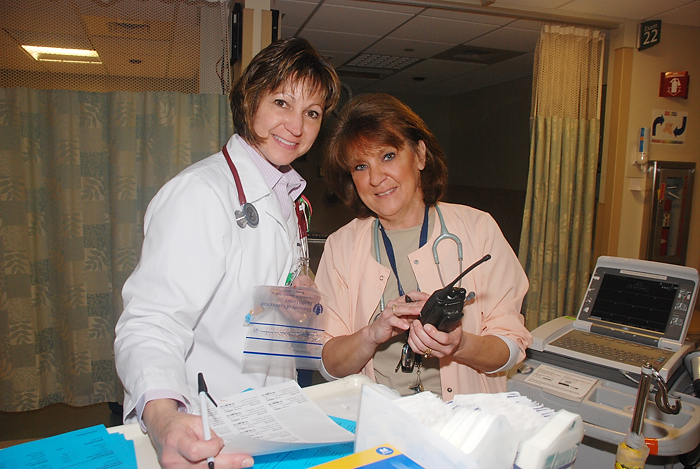 Sharon Levesque (left) and Kathy Williams are Emergency Department Nurses. Williams is a 2012 Nightingale Award winner; Levesque won a Nightingale Award in 2009. (Janine Gelineau/UConn Health Center Photo)