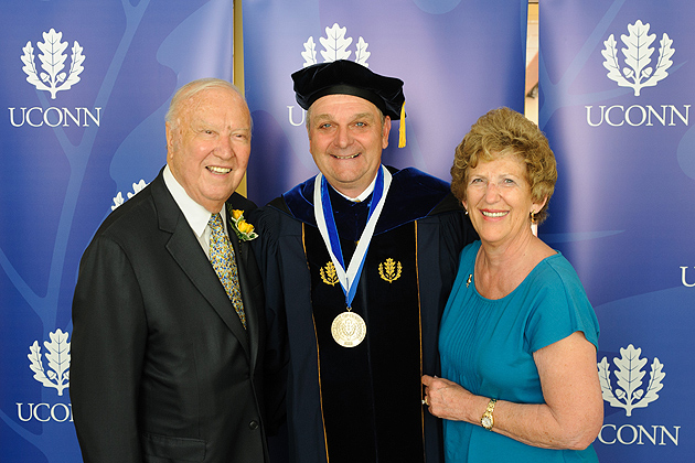 Richard L. Schwab, center, with Ray '56 (CLAS) and Carole Neag after a ceremony held at the Charles B. Gentry Building to invest Schwab as Neag Professor on June 7. (Peter Morenus/UConn Photo)