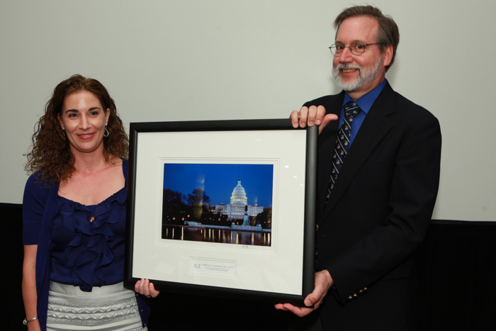 Dr. Thomas Tape, chairman of the ACP Board of Governors, presenting the 2012 Neubauer Award for advocacy to Dr. Rebecca Andrews. on June 6, 2012. (Rick Reinhard for American College of Physicians Leadership Conference)