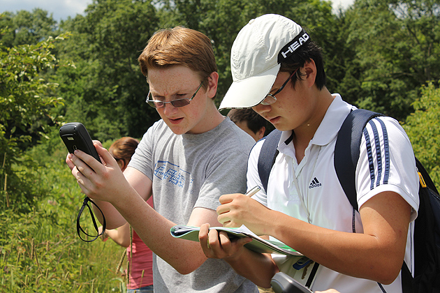 Grant Marsden from Tolland worked with Meng (Fred) Lu from Beijing, China (by way of Kent, Conn.) to check their coordinates. (Susan Schadt/UConn Photo)