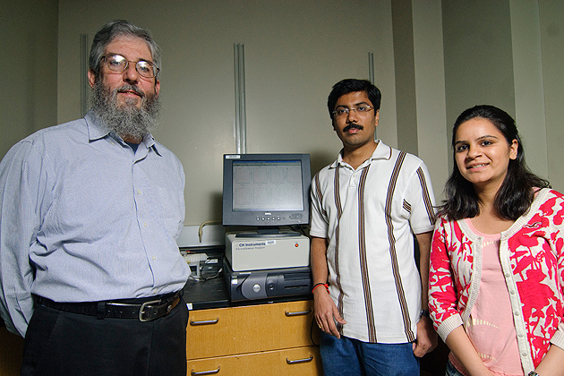 From left: James Rusling, professor of Chemistry, Bhaskara Chikkaveeraiah and Ruchika Malhotra in their lab in the Chemistry building. (UConn Photo / Jessica Tommaselli)