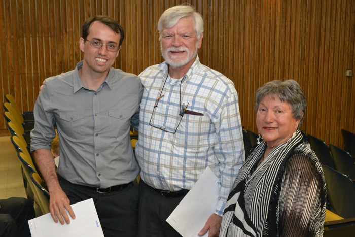 Auxiliary Facilitator Irene Engel (right) and dental professor Art Hand present a scholarship to periodontology resident Michele Furtado Araujo (left) at the Auxiliary's 2012 annual meeting on June 21, 2012. (Chris DeFrancesco/UConn Health Center Photo)