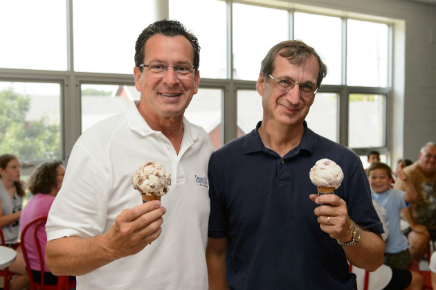 Gov. Malloy and Dean Gregory Weidemann debate which of Gov. Malloy and Dean Gregory Weidemann with their favorite UConn ice cream flavor. (Peter Morenus/UConn Photo)
