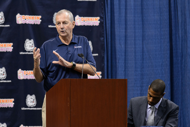Jim Calhoun, left, speaks at a press conference held at Gampel Pavilion to announce his retirement and the appointment of Kevin Ollie as head men's basketball coach on Sept. 13, 2012. (Peter Morenus/UConn Photo)