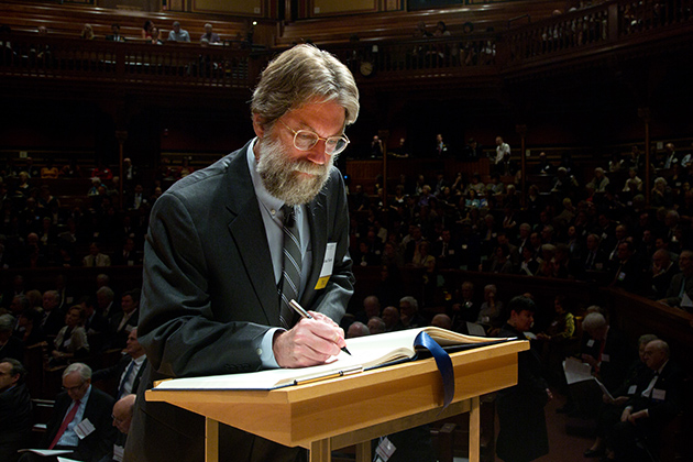 Michael North '76 MA, '81 Ph.D., Professor of English, University of California, Los Angeles, signs the American Academy of Arts and SciencesÃ Book of Members, a tradition that dates back to 1780.