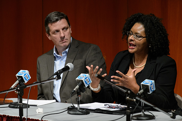 Shayla Nunnally, associate professor of Political Science, right, speaks during a panel discussion on election results at Konover Auditorium on Nov. 7, 2012. At left is Vincent Moscardelli. (Peter Morenus/UConn Photo)