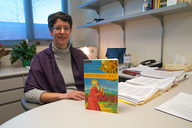 Clare Costley Kingo'o photographed with her Book, Miserere Mei, witch she received the Book of the Year award from Conference on Christianity and Literature on Jan. 24, 2013. (Sean Flynn/UConn Photo)