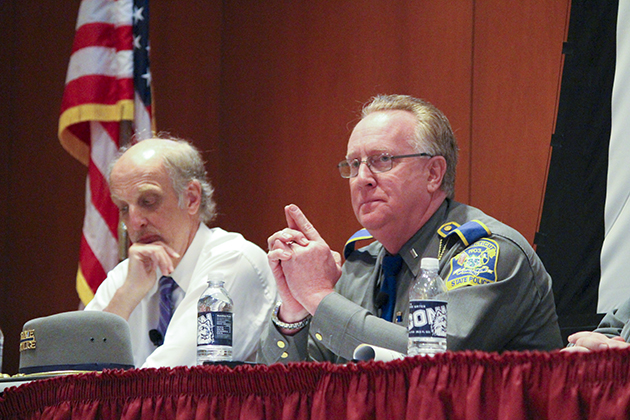 Connecticut State Police spokesperson Lt. J. Paul Vance, right, was the officer whose role was to communicate with the press during the aftermath of the Sandy Hook school shootings. At left is Bill Leukhardt, a longtime Hartford Courant reporter and stepfather of Lauren Rousseau, a 2004 UConn graduate and Sandy Hook Elementary teacher who was killed in her classroom during the shootings. (Christien Buckley/UConn Photo)