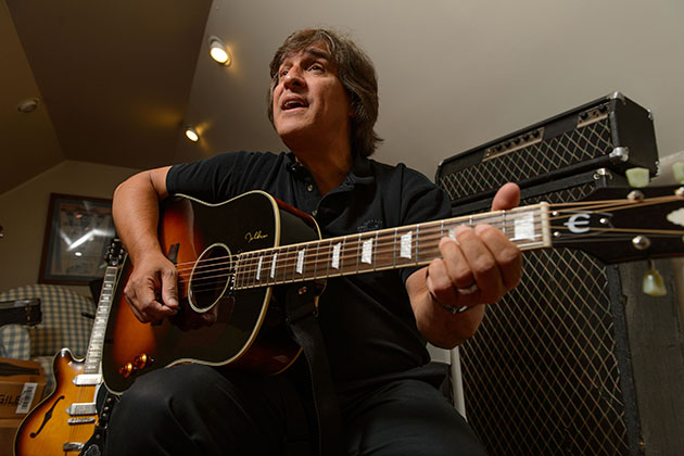 Carlo Cantamessa '83 (CLAS) at his home in Wolcott on June 12, 2013. He portrays John Lennon in "The Cast of Beatlemania." (Peter Morenus/UConn Photo)