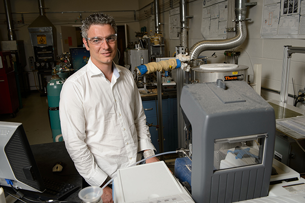 George Bollas, assistant professor of chemical materials and biomolecular engineering at his lab at the UConn Center for Clean Energy Engineering on July 24, 2013. (Peter Morenus/UConn Photo)