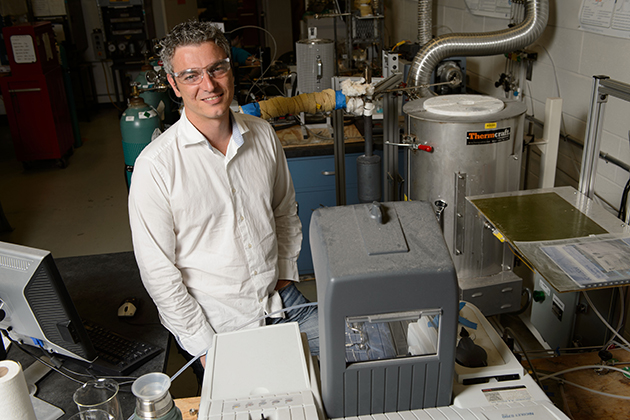 George Bollas, assistant professor of chemical materials and biomolecular engineering at his lab at the UConn Center for Clean Energy Engineering on July 24, 2013. (Peter Morenus/UConn Photo)