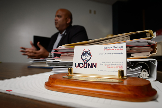 Warde Manuel, director of athletics, is interviewed at his office at Gampel Pavillion on Sept. 3, 2013. (Peter Morenus/UConn Photo)