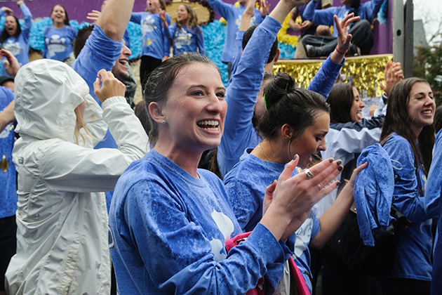 Delta Gamma and Alpha Epsilon Pi march down Gilbert Road during the Homecoming Parade on Oct. 6, 2013. (Juanita Austin/UConn Photo)