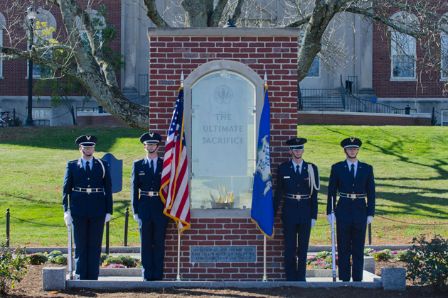An honor guard stands at TheUltimate Sacrifice Memorial on the Great Lawn on Monday, Nov. 11. during Veterans Day ceremonies. (Ariel Dowski '14 (CLAS)/UConn Photo)