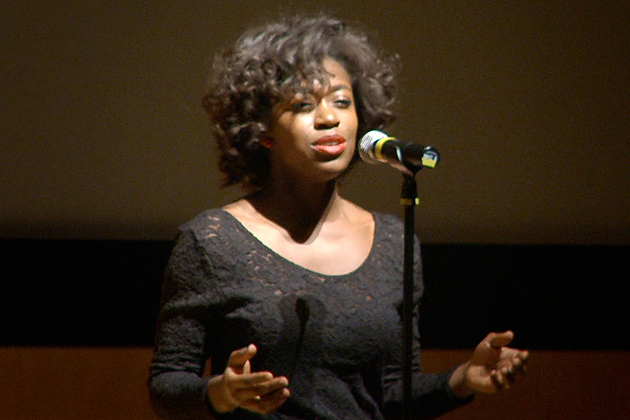 Shaelle Etienne '14, sings Etta James's 'At Last' during the Martin Luther King Day celebration in the Student Union Theatre on Jan. 20, 2014. (Bret Eckhardt/UConn Photo)