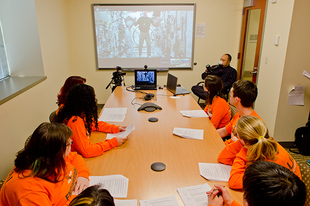 A group of engineering students and faculty discuss questions over video chat with astronaut Rick Mastracchio '82 (ENG) from the Charles B. Gentry Building on April 18, 2014. (Ariel Dowski '14 (CLAS)/UConn Photo)