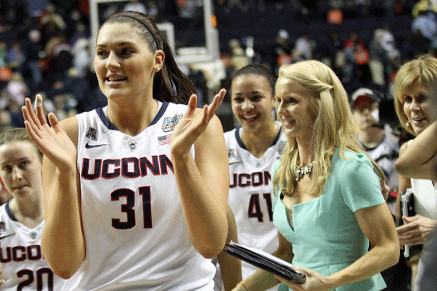 Stefanie Dolson '14 (CLAS) celebrates UConn's win over Stanford in the NCAA semifinal, together with her teammates and coaches. (Bob Stowell'70 (CLAS) for UConn)