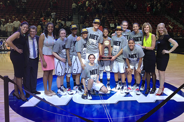 The Women's Basketball team pictured with the NCAA East Regional Trophy after winning their game Monday night against Texas A&M. They will face either Stanford or North Carolina in the national semifinal in Nashville, Tenn. on Sunday. (Bob Stowell for UConn)
