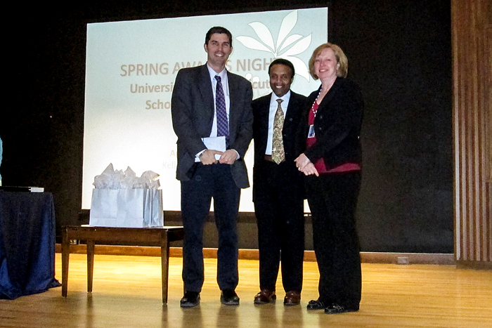 From left, Loeser award recipient, Dr. Jason Ryan with Dr. David Henderson, associate dean for student affairs, and Christine Thatcher, director of medical education. (Photo provided by Roselyn Wright)