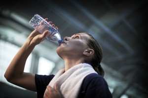 An athlete rehydrates after exercising. (Paul Horton for UConn)