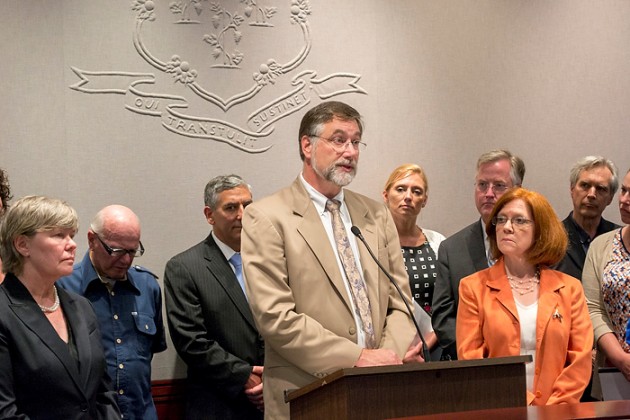 Dr. Daniel Connor addresses the Connecticut legislature on June 17, 2014. (Carolyn Pennington/UConn Health Photo)