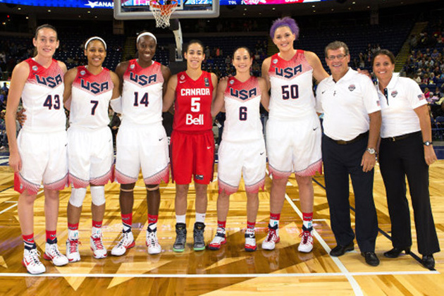 The Huskies who played in the USA-Canada exhibition gameat the Webster Bank Arena in Bridgeport gathered for a photo. From left: Breanna Stewart '16 (CLAS), Maya Moore '11 (CLAS), Tina Charles '10 (CLAS), Kia Nurse '18 (CLAS), Sue Bird '02 (CLAS), Stafanie Dolson '14 (CLAS), Huskies head coach Geno Auriemma and University of Hartford head coach Jennifer Rizzotti '96 (CLAS). (Steve Slade '89 (SFA) for UConn)