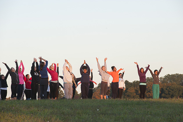 Sunrise yoga on horsebarn Hill on Sept. 22. (Sean Flynn/UConn Photo)