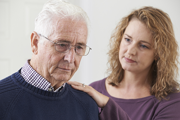 Alzheimer's caregiver with elderly father. (iStock/UConn Photo)