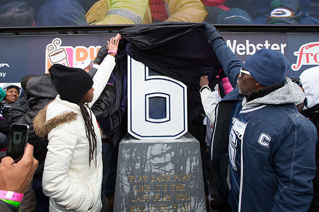 A memorial in honor of slain football student-athlete Jasper Howard, who lost his life five years ago, is unveiled by his family members at Rentschler Stadium during half-time of the Homecoming game against the University of Central Florida. (Stephen Slade '89 (SFA) for UConn)