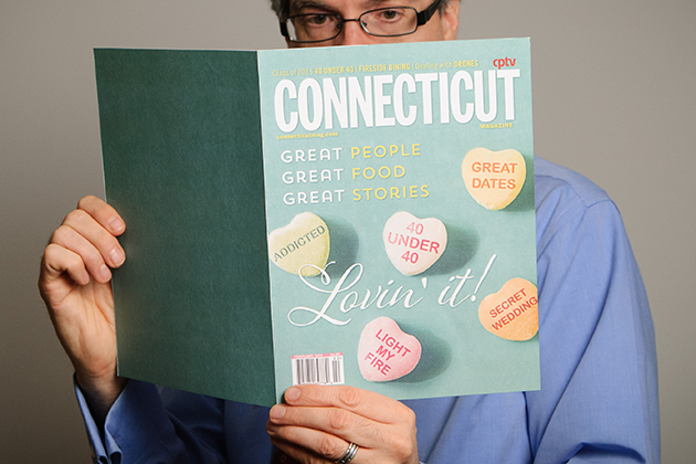An illustration of a man reading an issue of Connecticut Magazine on Jan. 22, 2015. (Peter Morenus/UConn Photo)