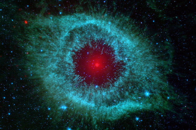 This infraredimage from NASA's Spitzer Space Telescope shows the H elix nebula, a cosmic starlet often protographed by amateur astronomers for its vivid colors and eerie resemblance to a giant eye. (NASAA/JPL-Caltech/Univ. of Arizona)