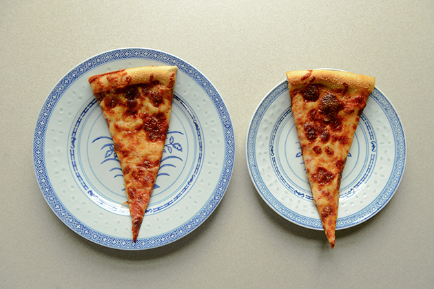 A large plate and a small plate, each with a slice of pizza. (Peter Morenus/UConn Photo)A large plate and a small plate, each with a slice of pizza. (Peter Morenus/UConn Photo)