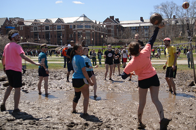 Oozeball, spring 2015, with South Campus residence halls in the background. (Angelina Reyes/UConn Photo)