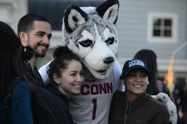Students pose with the Husky mascot at the Senior Send-off outside the Alumni Center on April 28, 2015. (Elizabeth Caron/UConn Photo)