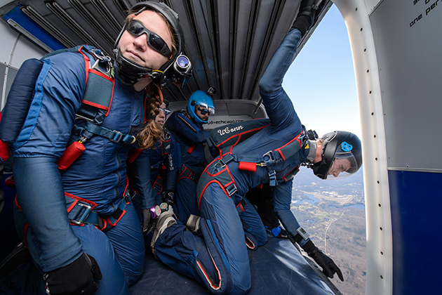 Members of the UConn Skydiving Club prepare to jump from an airplane over campus on April 25, 2015. (Peter Morenus/UConn Photo)